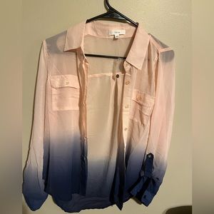 Pink and blue button up shirt. It’s a size small.